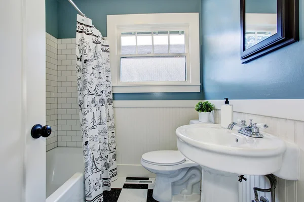 Light bathroom interior design with blue walls
