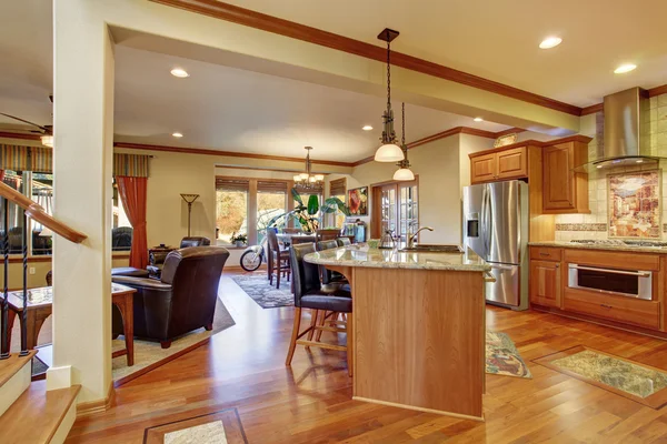 Open floor plan interior with living room, kitchen and dining area