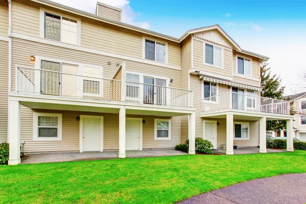 Traditional town house back yard with balcony