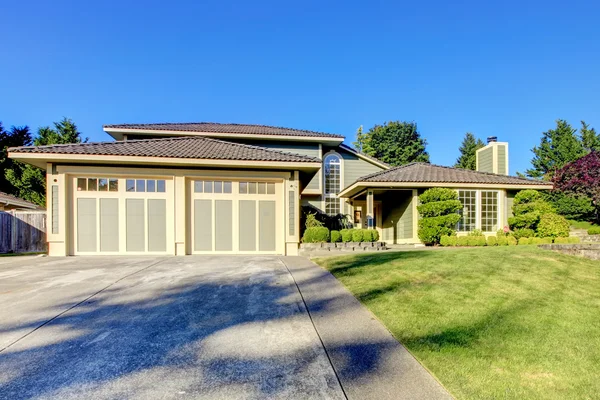 Nice curb appeal of modern gray siding house with french windows.