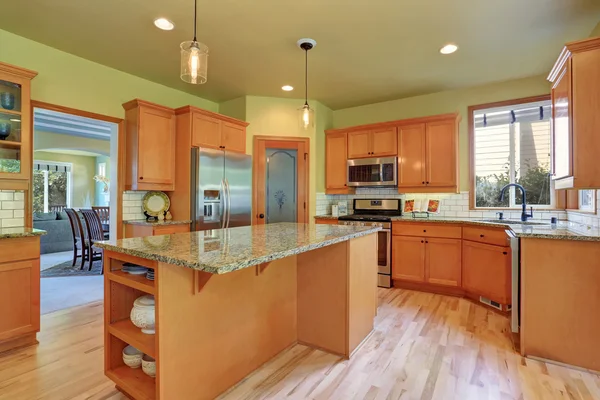 Light brown storage combination in large kitchen room