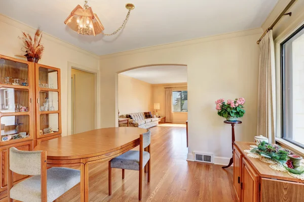 Cozy dining room interior with oval wooden table