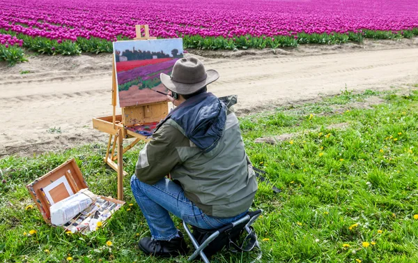 Washington, USA - April 16, 2010: Male artist on painting on canvas in outdoor. Plein-air.