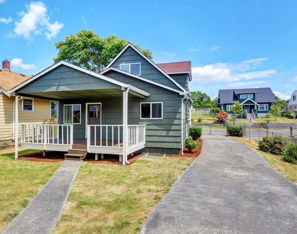 Traditional American house back yard exterior  in blue tones with walkout deck