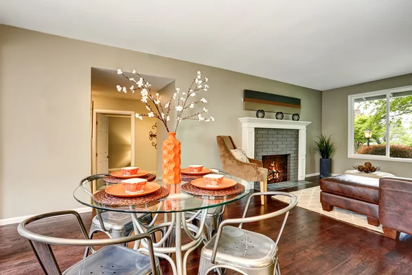 Open floor plan. Modern dining area with glass tab