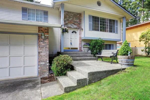 American two story house exterior with garage and double entry d