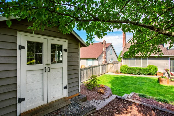 Well kept garden at backyard with barn shed