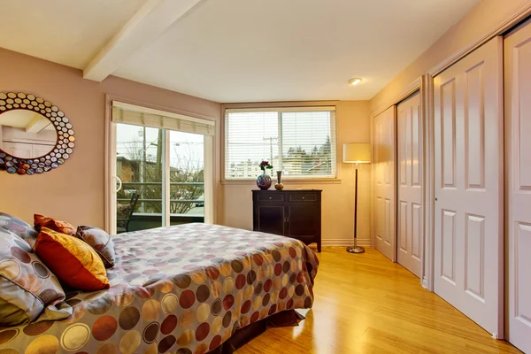 Bedroom interior in purple tones with wardrobe