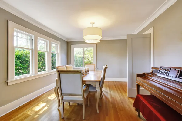 Open floor plan dining room with table set and hardwood floor.