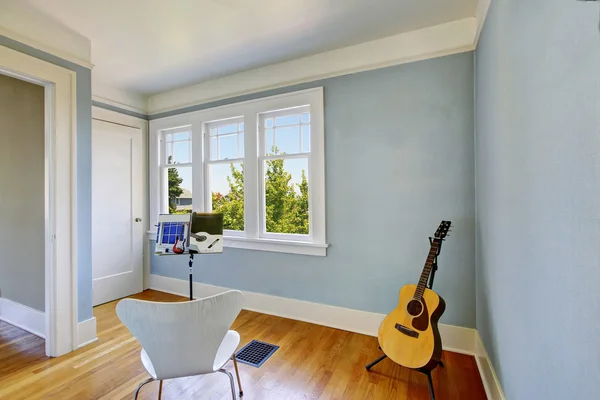 Musician home studio interior in blue tones.