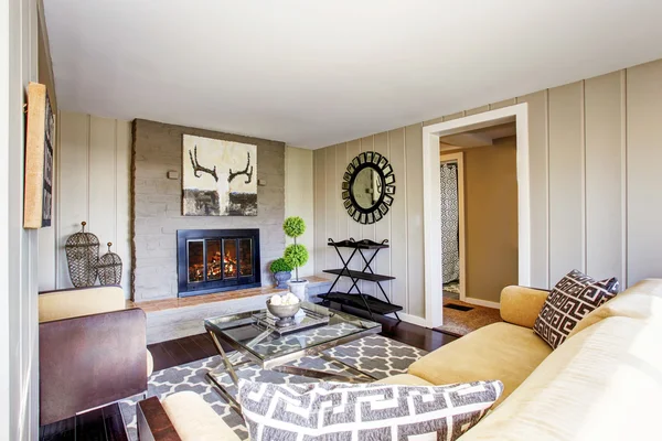 Open floor plan living room with fireplace, comfortable sofa
