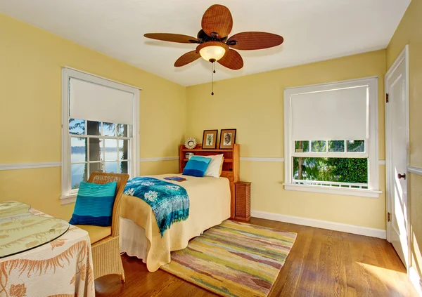 Craftsman bedroom interior with hardwood floor and rug.