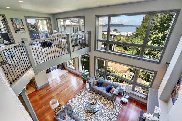 Panoramic view of elegant grey living room from upstairs.