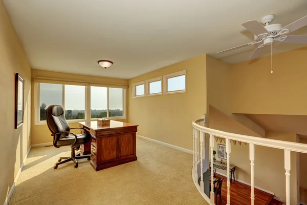 Upstairs home office interior design in yellow tones.