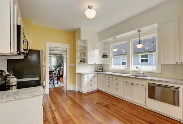 Kitchen Interior With White Cabinets Yellow Walls And Wood Floor Stock Images Page Everypixel