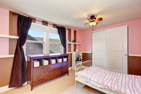 Minimalistic design of kid\'s bedroom  interior with pink accent walls