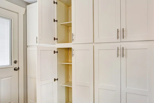 White big wooden storage combination for kitchen room