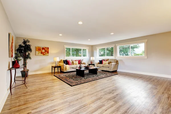 Spacious living room interior with polished hardwood
