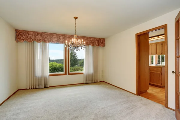 Empty room interior with carpet floor and nice chandelier