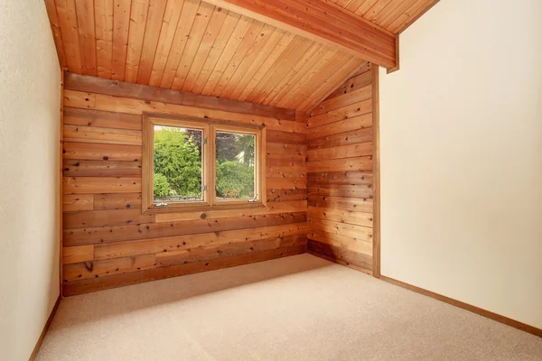Empty room interior with wooden panel trim walls and  carpet floor