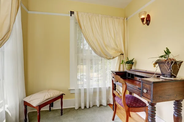 Adorable bedroom interior in pistachio color, wooden cherry furniture and nice curtains