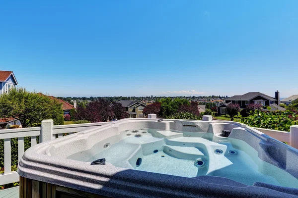 Close-up of hot tub. Luxury house exterior.