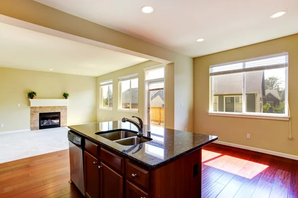 Modern kitchen island with granite top.