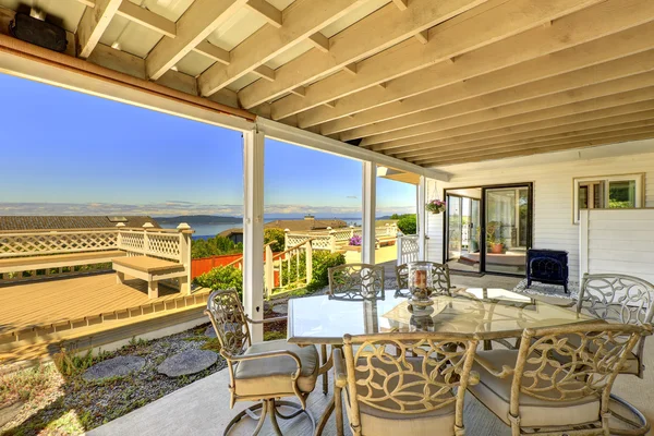 Walkout deck with patio area and scenic bay view