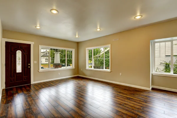 Empty house interior. Spacious living room with new hardwood flo