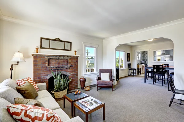 Room with brick fireplace in old american house