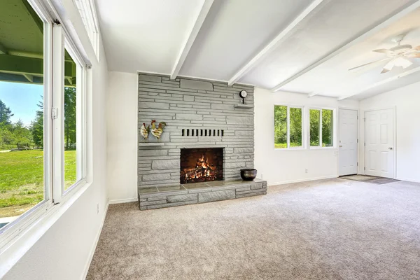 Empty old house interior with fireplace