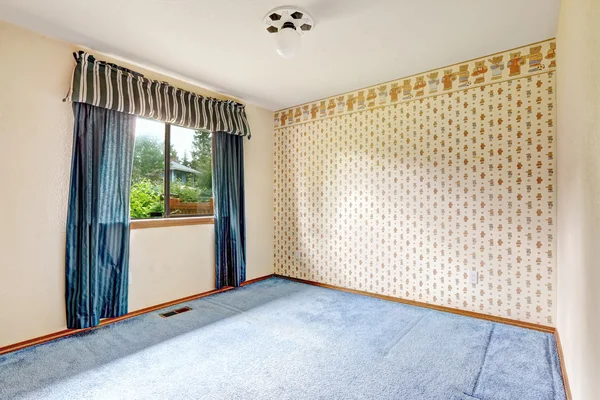 Empty room with wallpaper and blue carpet floor