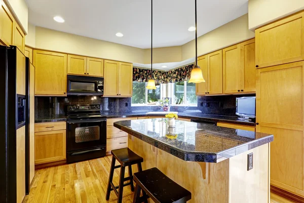 Kitchen with black appliances