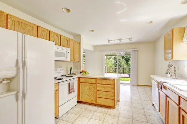 White kitchen room in empty house with walkout deck