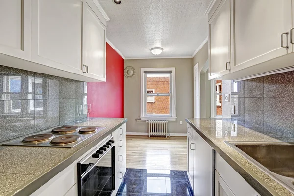 Empty apartment with kitchen and dining area