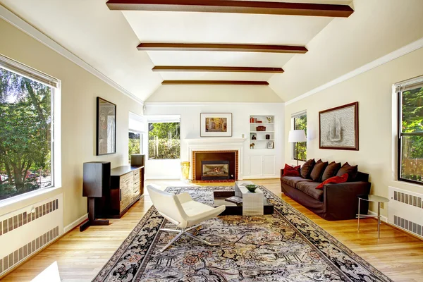 Vaulted ceiling with brown beams in living room