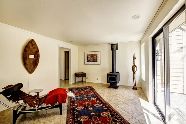 Bright room with resting area and antique stove