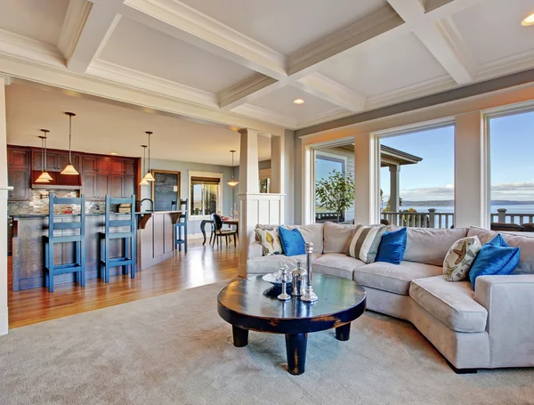 Luxury house with open floor plan. Coffered ceiling, carpet and