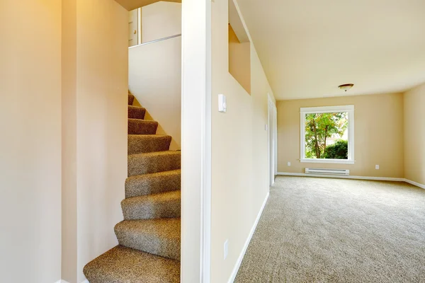 Staircase with carpet steps in empty house