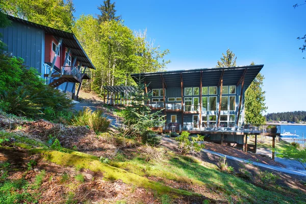 Large covered porch of luxury home with lake view.