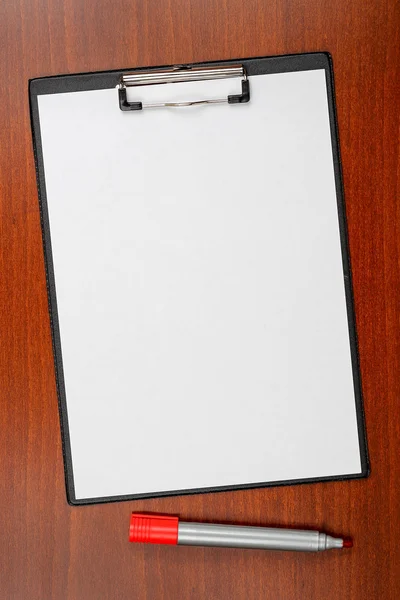 Blank clipboard on desk