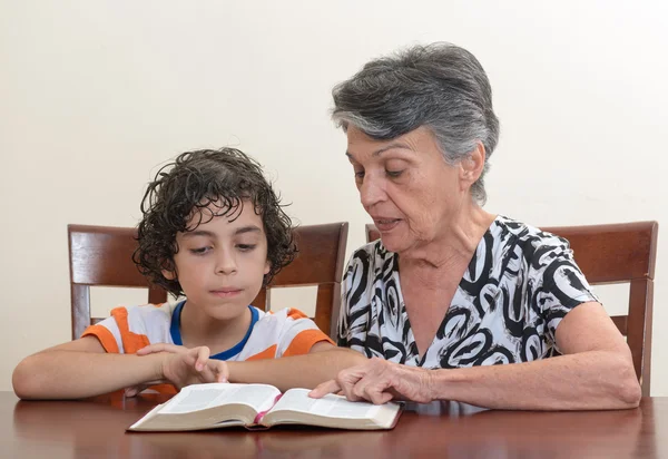 Hispanic Family Studying the Holy Bible