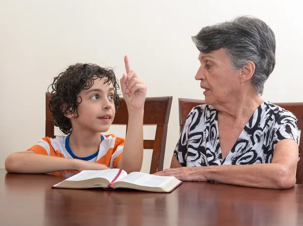 Hispanic Family Studying the Holy Bible