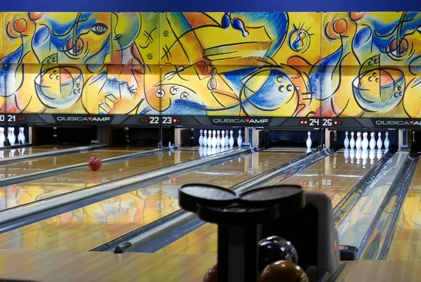 Close up ball rolls down a bowling lane
