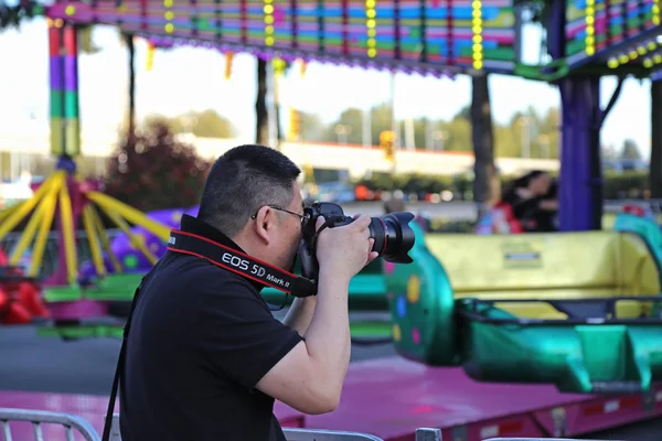 People having fun at the West Coast Amusements Carnival