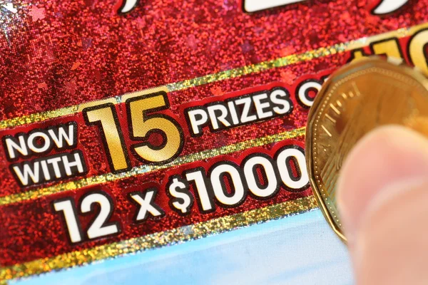 Close up woman scratching lottery ticket called set for life