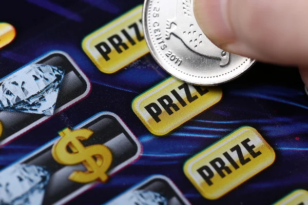 Woman scratching lottery ticket