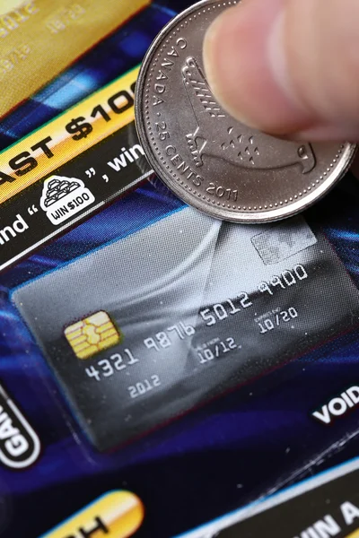 Woman scratching lottery ticket