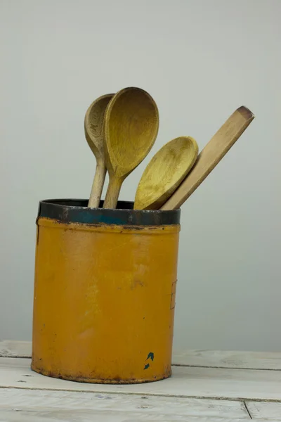 Wooden spoons in a tin