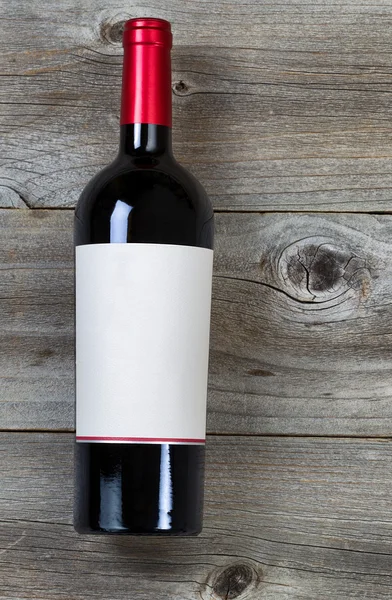 Red Wine Bottle on weathered wood